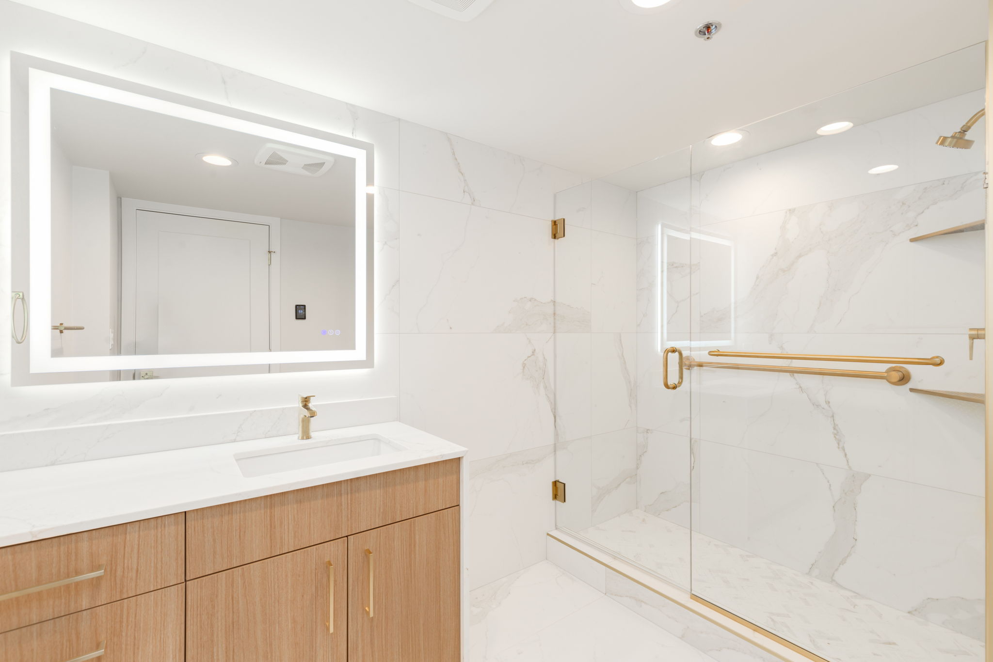 Marble bathroom renovation with walk-in shower